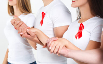 Group of friends  with watercolor of red ribbon .world AIDS day concept. On the white background